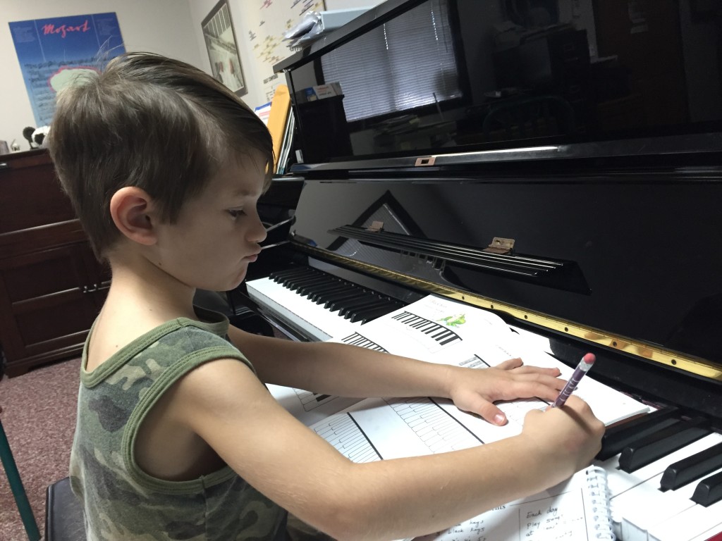 Evan Skoubis at his first piano lesson